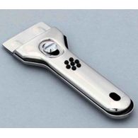 Grattoir plaque cuisson